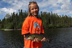 Gabrielle Dunlop walleye fishing in river behind camp.