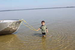 Noah pulling dad's boat to shore 