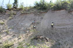 Playing on sand hills in Big Sand bay south of camp