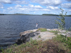 Zachary fishing of the point in front of the cabin. 